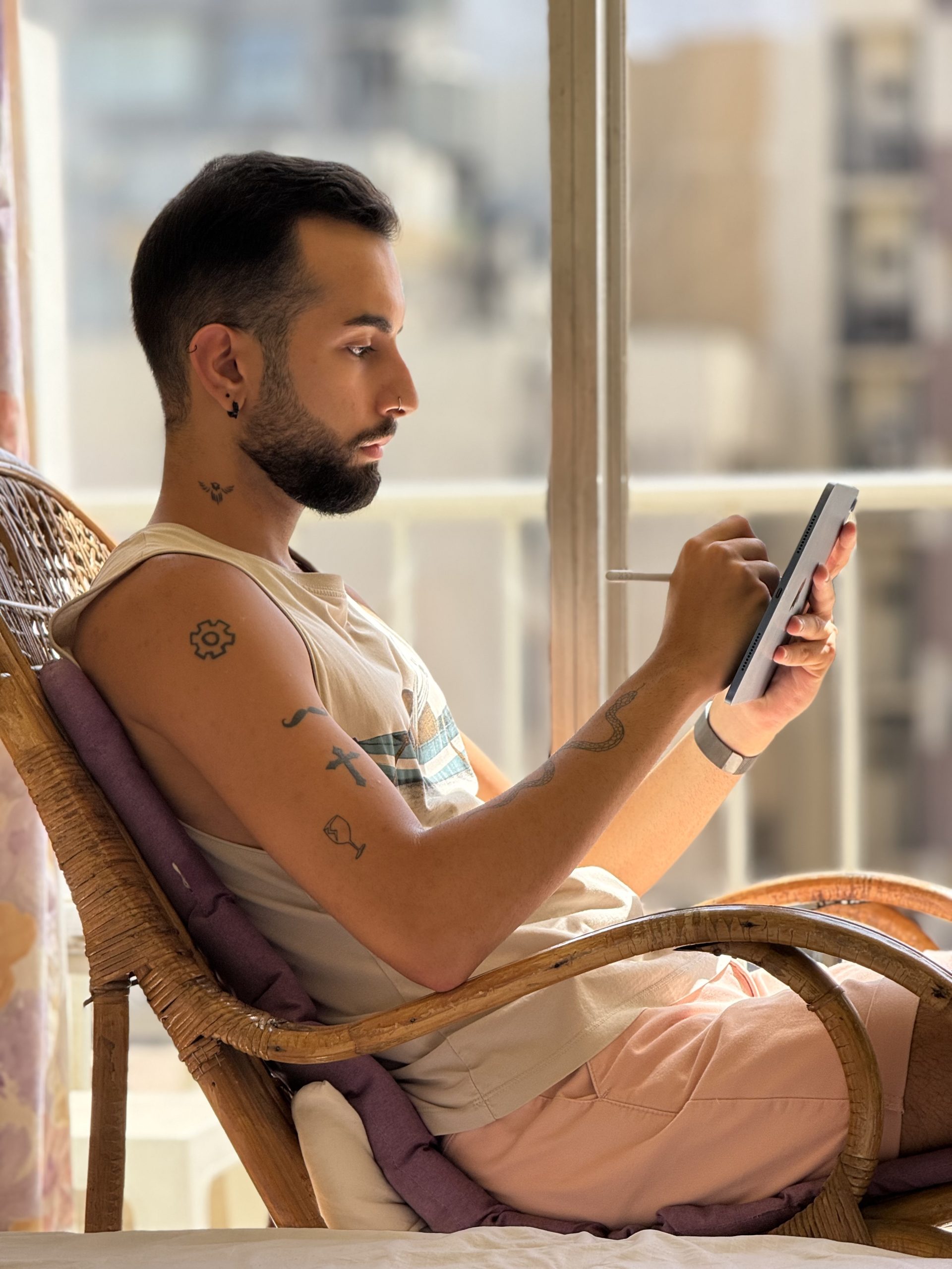 Picture of a person writing with an Apple Pencil taken  with the iPhone 16 Pro Max at 5x telephoto